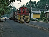 A Ron Tuff photo, posted with permission. Long ago TH&B 53 on Hatt Street in Dundas, Ontario on the TH&B "H&D" branch returning with a couple of loads from Canada Cut & Crushed Stone. Speed limit on the H&D was maximum 15 mph with some other restrictions as well. In my brief time on the TH&B, I had the experience of three trips from Aberdeen Yard out to Dundas on the H&D branch. It was usually the 7 AM, Aberdeen Yard crew that was lucky enough for the trip to Dundas and service the few customers there, Bertrams, Valley City Manufacturing as well as CC&CS "the quarry". The houses in the photo look very familiar but I can't locate them precisely for the GPS location.