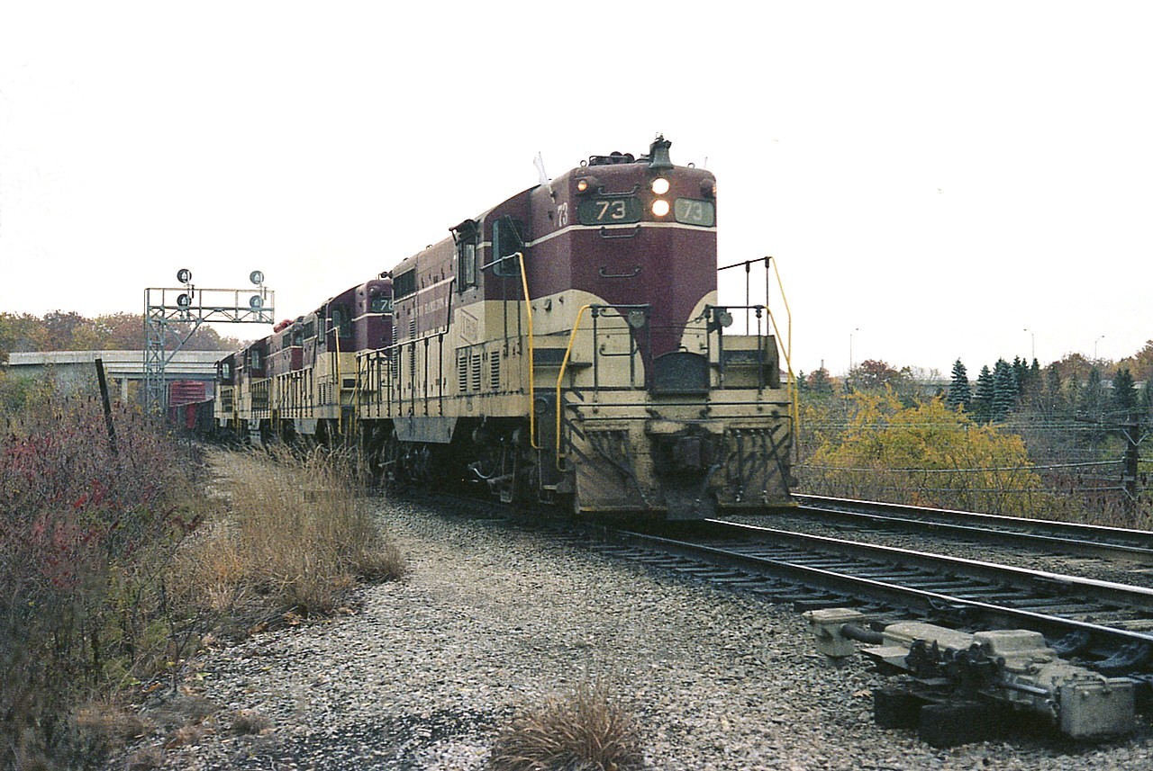 The days are getting shorter by the end of October when I decided to wait for the Starlite to come in; that daily Toronto to Hamilton and return general merchandise train.  Since it was due thru here most days between 1600 and 1630, and often delayed, I realized my chances of half decent photos of it would be slim thru the winter months once again. Also, the days of TH&B power were limited now that CP had taken the road under their wing.  Bonus this locomotive consist was all TH&B !!! Units 73, 76, 402 and 75. Not bad at all.