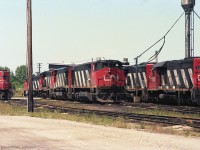 An interesting collection of CN locomotives at a terminal on 11 Aug 1991. I have mapped it as Sarnia, hope that is correct. <br><br>
From left to right are GP40 CN 9306; GP40-2W's CN 9531 and 9551; HR616's CN 2113 and 2111; a CN GP40-2W,  and SD40 CN 5036. Out of the picture to the right were GP40's CN 9304, 9302, 9305. All GMD locomotives except the Bombardier HR616's.


