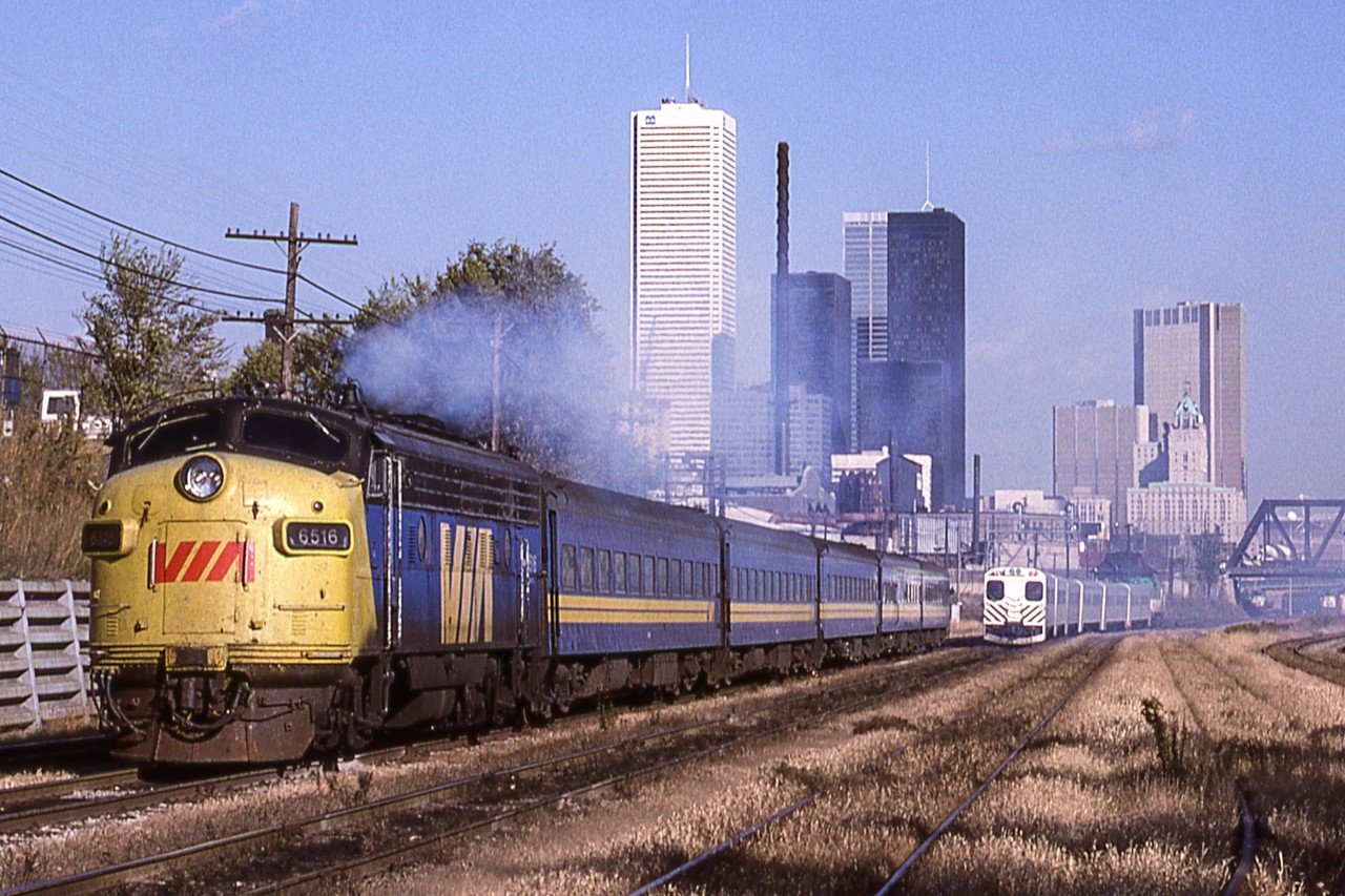 An unknown photographer caught VIA 6516 heading west with train #83. This photo was taken in Toronto on October 31, 1980.