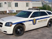 Railway Police Dodge Magnum Wagon by the old Oshawa yard office trailers. Part of the GM complex is visible in the background.