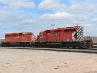 SD40-2's 6005 and 6020 awaiting transfer with "do not occupy" signs taped to the cab doors.