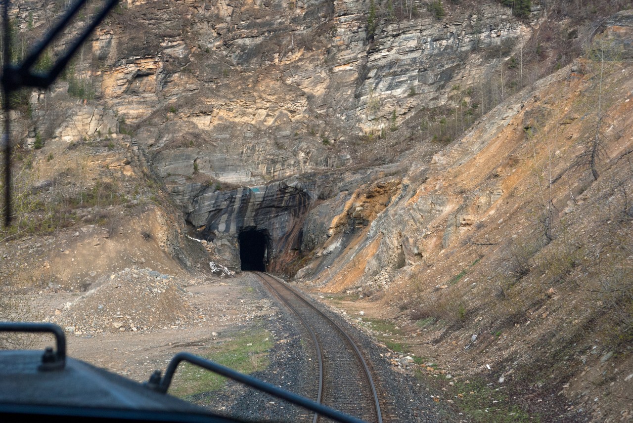 Heading into the south end of the tunnel at mile 597.9 of the former BC Rail Chetwynd Sub located between Azouzetta and Garbitt. This 473 relief was one of the strangest calls I ever got while on the Fort St John engr spareboard. Trains in this territory are normally operated by Prince George crews, with Chetwynd crews filling in when no PG guys are available. But with no one available at either terminal, Fort St John board is the next one down the line.