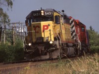 Back when SD40’s were a dime a dozen on CP it was the 5400’s that I usually set my sights on, especially the ones still in their previous owners paint. CP 5431 was the highest numbered former UP unit on the roster and wore this paint until it was sold to NRE in 2005. The unit began life as Missouri Pacific 3197 before being repainted and numbered Union Pacific 4197. It is seen leading an intermodal train westbound at Streetsville in August 1997.