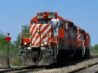 It blows my mind to think that this photograph was taken 18 years ago. It was May 7, 2001 and for me it was a very somber day but an opportunity I couldn’t miss taking. I have always had a fascination for the TH&B Railway even though it vanished before I picked up my first camera. For years I had hopped to catch a train on the now CP Dunnville but  time and distance from my home always played against me. I knew the writing was on the wall for sometime for the north end of the subdivision thanks to several wooden trestles needing repairs as well as the bridge over Highway 20 in Smithville. CP decided instead to rebuild a portion of the former Canada Southern mainline in order to reach the south end of the a Dunnville subdivision and the industries at Port Maitland. This would allow CP to abandon everything between E&O junction (junction with the CASO) and Smithville. As luck would have it this day I was an extra at work and was able to leave work early and race down to Smithville. As it turned out I completely missed the trip to Port Maitland but waited out my time at E&O junction watching work crews ready the new switch connecting to the former CASO. Around 9:30am a headlight finally appeared in the distance, and the slow chase was on. Unfortunately I missed a few wooden trestles I wanted to photograph but did fairly well nonetheless. When the train reached the wye with the Hamilton Subdivision at Smithville the entire line north of E&O junction was officially abandoned for good. The friendly crew briefly stepped down for a few photographs with the dozen photographers on hand, including some from the TH&B historical magazine before locking the switch one last time and heading for the yard at Welland. 