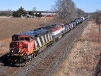 CN 2411 - BCOL 4613 cruise under Blenheim Road with CN M33131 23. They had just completed making a lift of outbound Nanticoke traffic at Paris 