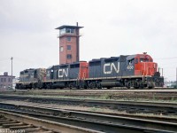 CN GP35's 4000 and 4001 are coupled with GP9 4502, moving around as light power at Mimico West. The yard tower at the west end of Mimico Yard is visible in the background, located between Canpa Tower and Kipling Avenue. There was another tall yard tower in Mimico near the <a href=http://www.railpictures.ca/?attachment_id=32164><b>east end of the yard</b></a>.
<br><br>
Both GP35's pictured were the only two units of that 2500hp model CN purchased, built by GMD in 1964 (and later renumbered 9300 & 9301). They would remain orphans as CN's subsequent 4-axle GP purchases from GMD would be the upgraded and more powerful GP40 model (4002-4017), and later on various groups of 5500-series GP38-2's and 94/95/9600-series GP40-2LW's.
