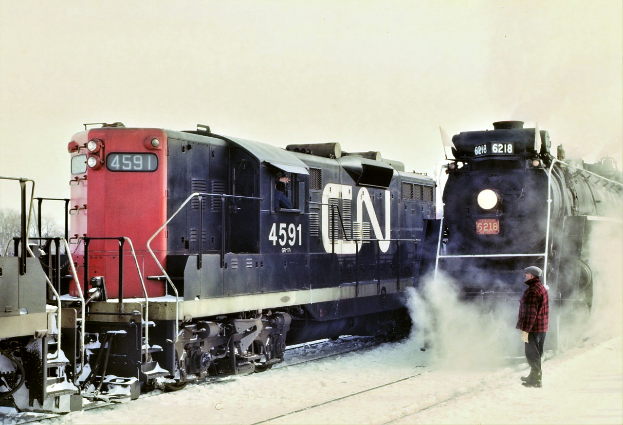 The train order was simple: EXTRA 4591 SOUTH MEET PSGR EXTRA 6218 NORTH AT BARRIE. EXTRA 4591 SOUTH TAKE SIDING AT BARRIE.  The photo shows that train order being fulfilled.  The date of February 18th 1967 is a best guess as the 6218 most likely brought a train load of passengers up to the Barrie Winter Carnival. It was a typical cold drab winter day.