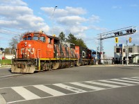 On May 5, 2019, CN 568 ran to Stratford then upon return to Kitchener, did a run down to the interchange to drop off the cars from Stratford. The northbound run in the spring/summer evening offers some good photo ops so I had to take advantage of the nice light. It is pictured at the Ottawa and Mill St. intersection heading back to Kitchener Yard light power as CN 4784, CN 7068 and GMTX 2264. The far tracks are the LRT line, with the Mill St. station out of sight behind the power.