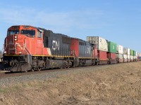 CN 5744 and CN 2453 are just leaving the outskirts of Edmonton at 8:30. It's a beautiful day to be heading out for Mirror, Alberta. 