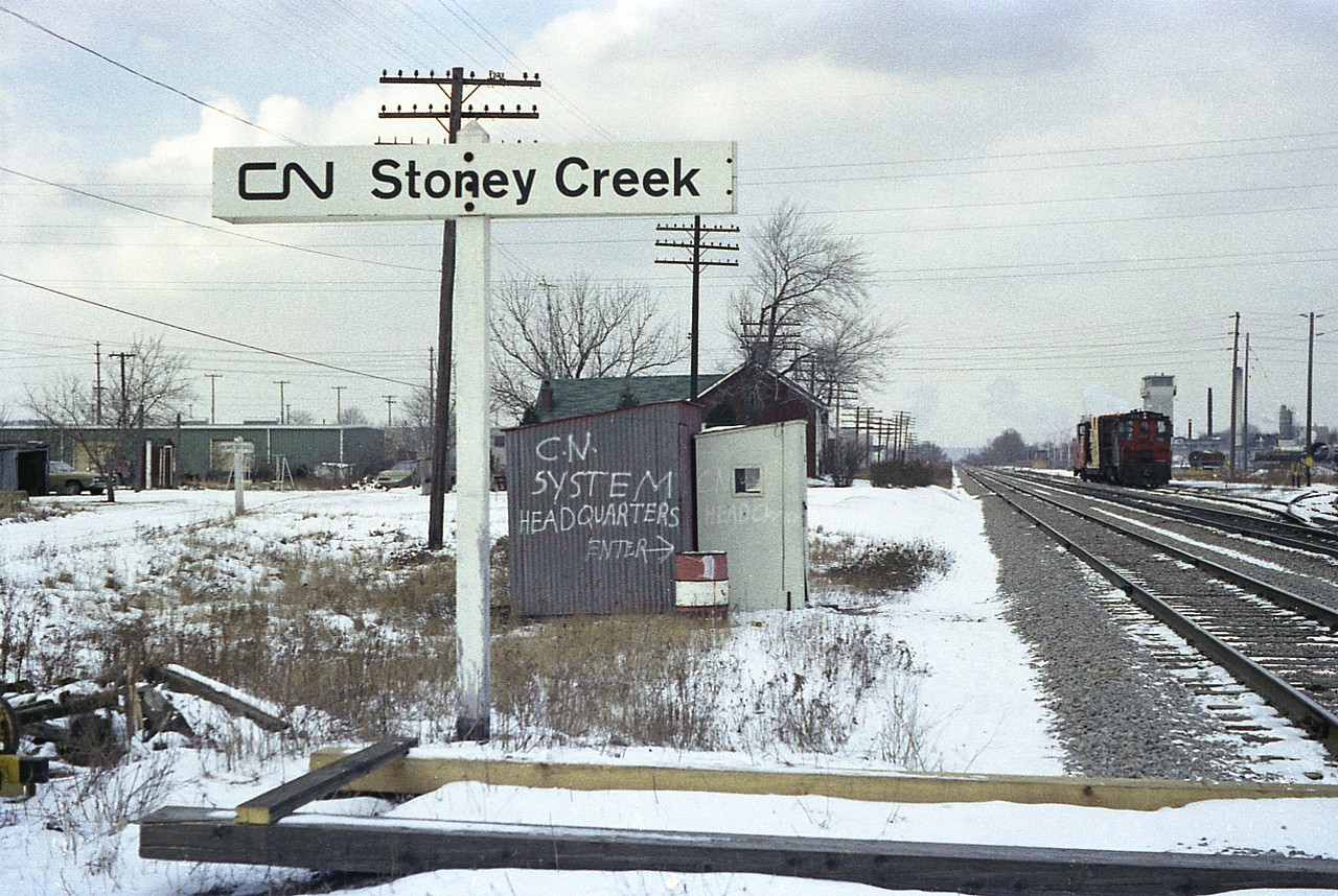 Long ago silliness. Spotted this while wandering on my first regular day off work in 1977. The switcher in the background was likely working Waxmans (scrapper) which is in the background on the right. This is where the Stoney Creek WalMart is located today. The track veering off to the right was once the beginning of the CN Beach sub. It was reduced to a stub in the early 70s when the infamous Stoney Creek (QEW) traffic circle was removed. The Beach Sub at the time was elevated over that circle and ran to a connection with the CN Oakville sub just a hair east of the old Freeman Station by Brant St in Burlington.