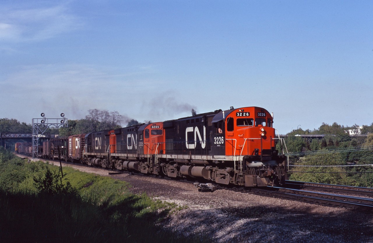 A trio of C424s (3226,3205, and 3223) lead a CN westbound freight through Bayview on a beautiful August evening.