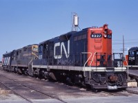 On a summer 1971 trip timed to coincide with the NMRA Convention in Calgary, a stop by CN's Sarcee Yard in Calgary turned up this consist--"branch line" GP9s 4337 and 4287 (still in green and yellow!), and an unidentified F7A. I also caught an F7A-GP9 combination there, as well as some SD40s