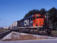 An Extra East passes the "Fort Erie South" station before yarding, having completed its run over the Dunnville sub. While I don't have a recorded train ID, this likely is 386 which would have originated on the GTW in Battle Creek at 1000 the day before and was due into Fort Erie at 0900. It handled traffic for eastern connections at Buffalo and was handed over to CN at Port Huron, travelling east on the main line to Brantford where it would normally change to the Dunnville sub for the balance of the trip to Fort Erie. (Not only was travelling via Canfield 15 miles shorter, it avoided descending and climbing the Niagara Escarpment at Copetown and Thorold, as well as congestion at Bayview/Hamilton.) 386 and its westbound counterpart 387 were re-routed via the Dundas, Grimsby and Stamford subs in the mid-1970s (after completion of the Welland Canal rail relocations and CTC on the Stamford sub and part of the Dundas sub). The Dunnville sub was removed from service east of Caledonia in the late 1970s and formally abandoned in the mid-1980s. 