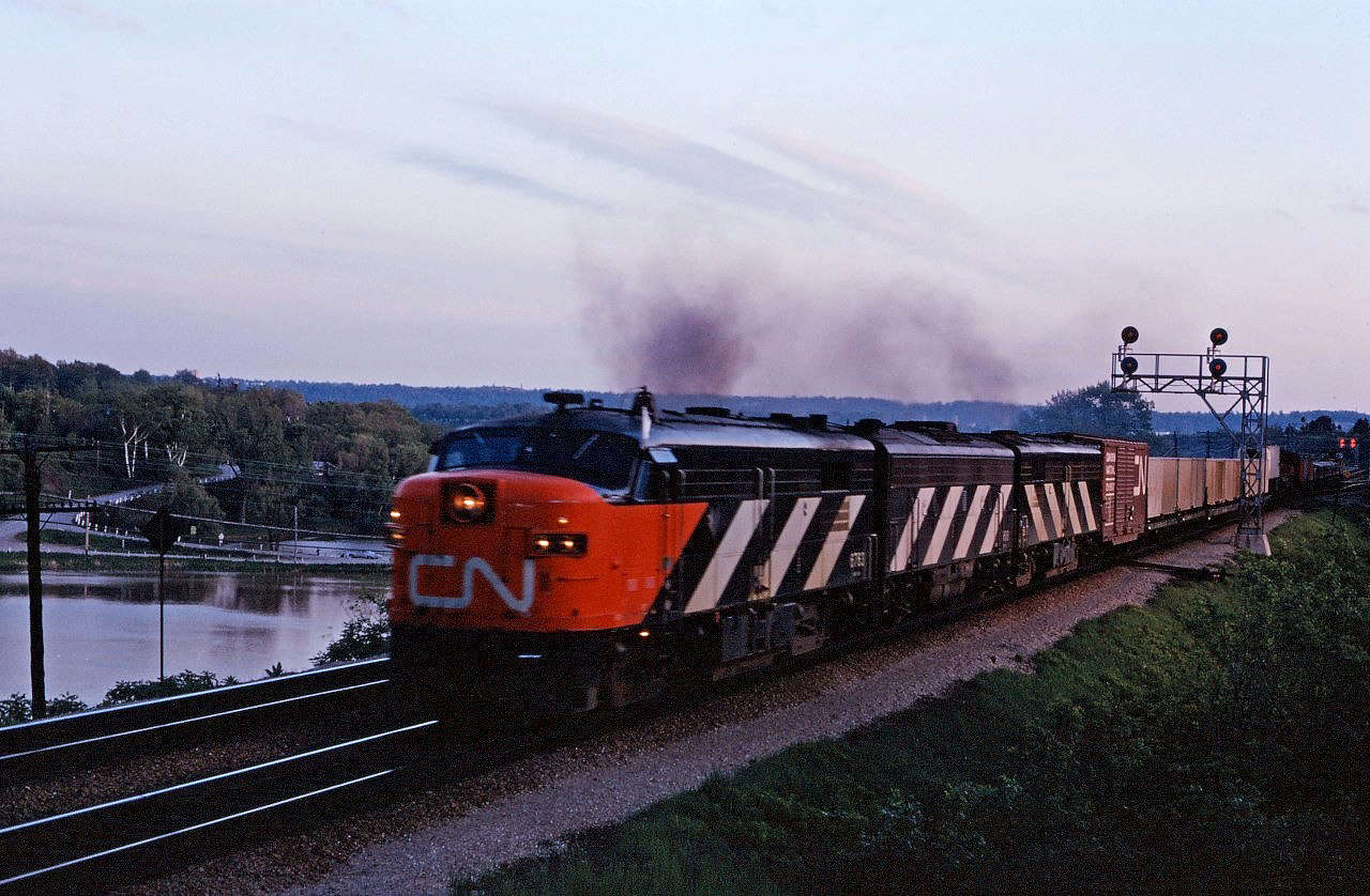 In the early 1970s, one could occasionally find CN passenger power in freight service. Here we have train 252, the Monday-Friday piggyback and container train just beginning its nocturnal trip to Montreal behind FPA4 6763 as well an F9B and FPB4. (Spadina was also know to "grab" units laying over and use them on Oakville sub runs.)