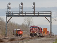 <b>Turf War.</b> I find myself more and more drawn to the Niagara area for railfanning these days. There's an endless amount of railway history here, as evidence by <a href="http://www.railpictures.ca/?attachment_id=37460">Mr. Mooney's shot</a> at nearby Welland. There's also <a href="http://www.railpictures.ca/?attachment_id=27698">Trillium</a>, <a href="http://www.railpictures.ca/?attachment_id=37237">the Wabash transfer</a> (Norfolk Southern) and even <a href="http://www.railpictures.ca/?attachment_id=37295">Amtrak</a> throws some cool stuff into the mix some times. On a lucky break today CN ran solo 8843 from Port Robinson to here at CN Duff, just 3 miles from the International Bridge. While 8843 under, road number 232, was was pumping up the air on the siding the CN dispature brought CP 255 across the boarder past 232 in the meantime. 255 would continue to Welland where they would yard there entire train, lift and then continue onto Hamilton with 7 empties in tow. As shown in <a href="http://www.railpictures.ca/?attachment_id=37442">James Knotts shot</a> at Fort Erie from the previous day, the autoracks were brought over from the States by CN 538.232 would take them to Oakville yard, after an unexpected stop at Port Robinson to set off a car which was mistakenly brought across the boarder in this cut.