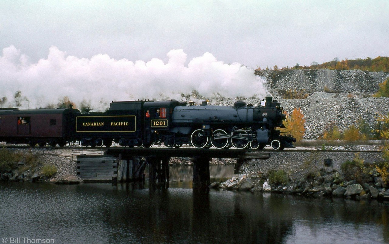 Canadian Pacific G5a 1201, donated by the CPR to the National Museum of Science and Technology in 1966 and restored to operating condition at CPR's John St. roundhouse in 1973, is shown at Farm Point (Mile 16.3) on the 80 mile Maniwaki Sub. The 1201 (one of two light Pacifics built by CP's Angus Shops in June 1944 and the final steam engine built by Angus Shops) went on to run in steam excursions in the 70's and 80's operated by the Bytown Railway Society until she was retired in 1990 and returned to the museum.

This section of CP's Maniwiki Sub along the Gatineau River between Hull and Wakefield survived as the Hull-Chelsea-Wakefield Railway until washouts and damage to the line halted operations for good in 2011. Ultimately, the municipality of Chelsea voted to tear out the line in 2017.