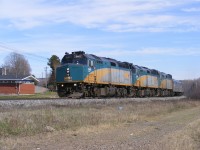 VIA Rail's westbound Ocean #15 rolls through the village of Maccan, NS with a trio of F40PH-3 locomotives pulling a HEP coach set