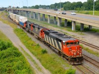 SD60F CN 5506 (now retired) and SD60's CN 5438 & CN 5405 lead CN 120 past the switch to the Lachine Spur. Service to the spur would be discontinued a bit over a year later, and the main line here moved further north last year due to highway work, which saw the elevated lanes at east removed as well.
