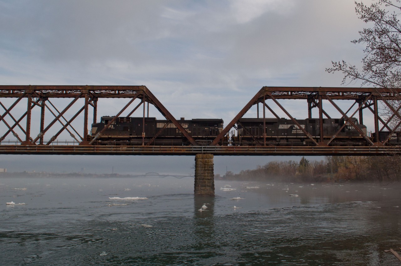 The daily NS Transfer heads back to the US after interchange with CN 531. Both trains headed into the states with about 70 cars each which made for both lengthy trains. Underneath in the Niagara River, ice still continues to flow down, where up stream it made international news for the ice build up crashing over the retaining walls. The fog made for an interesting element which made me wish I saw something come into Canada today but this was good enough for me.