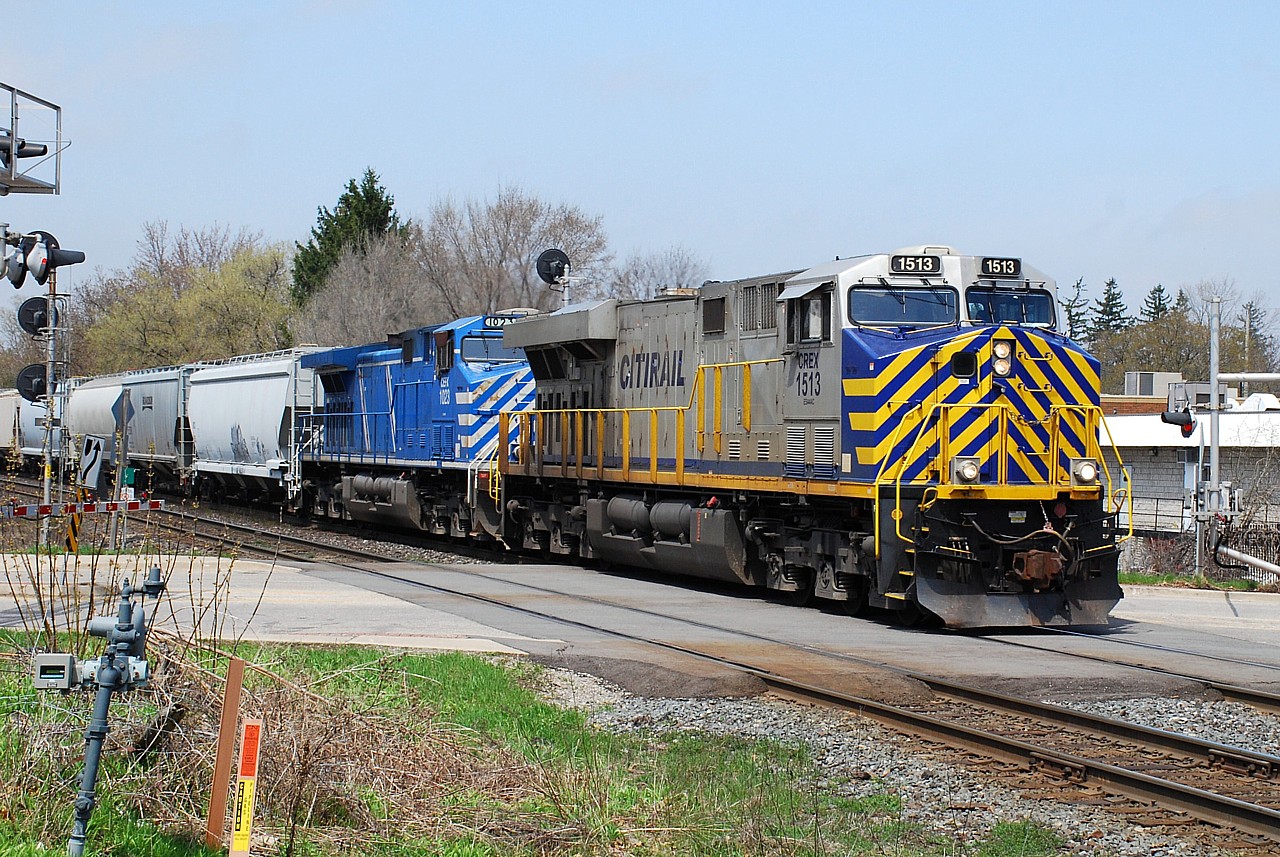 Despite some of the GECX leasers being returned, there's still some colour to be found on CN rails.  CN 394 is crossing Hardy Road, just west of CN Hardy, with CREX 1513 and CEFX 1023.  Being 1:30 p.m. (a late lunch hour for those concerned), I avoided the standard-issue station shot worried that VIA 73 would block 394.  73 ended up being late so I didn't need to venture further afield after all.  Thanks for the heads-up Jimmy G.