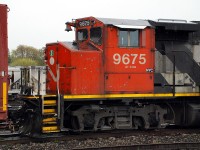 Former CN 9675, now sub-lettered NYC, is the fifth unit on 580 resting in the rain while the crew takes a lunch break.  Could this be the first sign of a forthcoming merger between two Hunter Harrison legacy railroads?  Will the GP40-2L(W), built new as GO 708, soon wear CSX blue/yellow?  Oh the excitement!   
