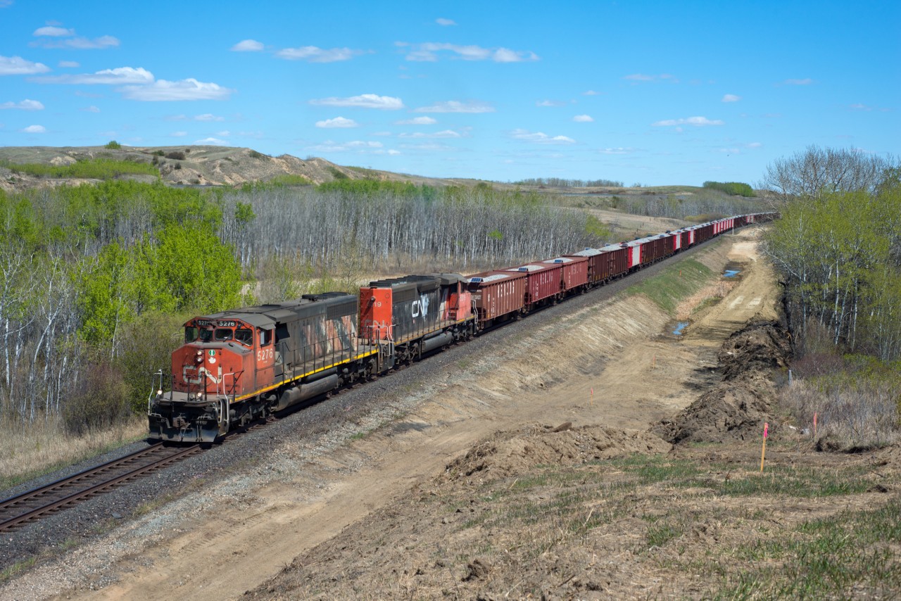 Well its 2019 and here we have a pair of SD40-2W's out on the mainline. The classic pair of London built GMDs work their guts out hauling ballast loads into Biggar. The ballast may be part of the double-tracking project going on in the area, the beginnings of which are visible in the foreground.