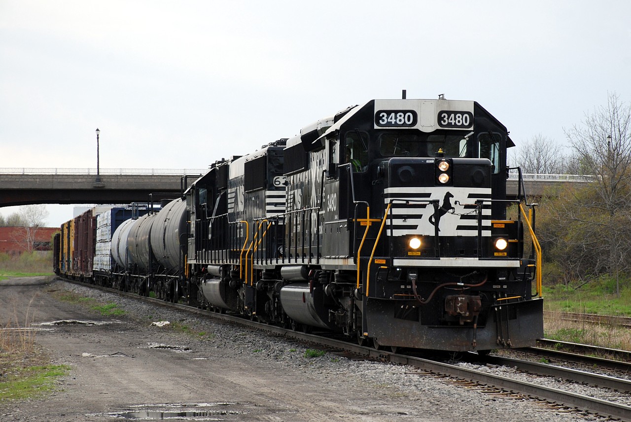 NS C93 has completed their switching in Fort Erie and has pulled up to the International Bridge to briefly wait for a single before returning to the States.  NS 3480 was built as BN 7265 and was acquired from NRE in 2012.  I didn't notice at the time, but it looks like C93 has a mascot riding the sand fill cap on the nose of the locomotive.