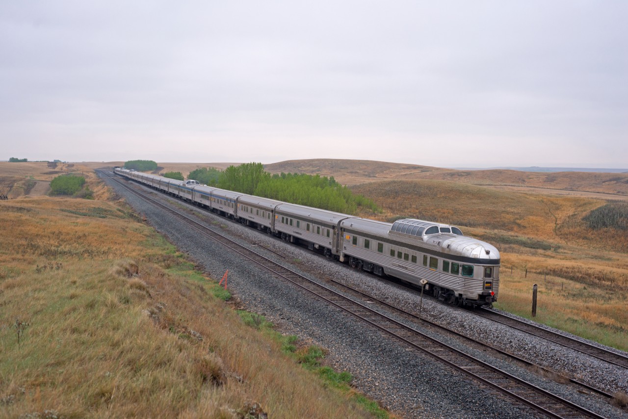 "Prince Albert Park" brings up the rear of a 22-car VIA#2 as they head east through Keppel SK. Differing CN and CP whistle posts add some further interest to the scene.