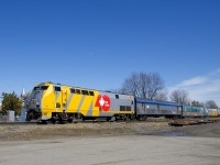 VIA 65 is comprised of VIA 919, one HEP baggage car and five LRC cars as it approaches Coteau Station at track speed, next to no VIA trains stop here.