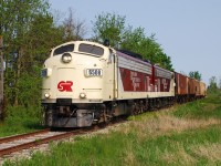 The crew of Ontario Southland's Woodstock Job had a long day today.  They started off heading to Tillsonburg to do a few hours of switching before heading to Cami in Ingersoll, and then finally heading to Woodstock to interchange with CP.  On their first jaunt of the day, OSRX 6508 and 1401 lead five hoppers at the Hwy. 19 crossing south of Mount Elgin.  The F's just don't look right hauling modern graffiti-covered auto racks, so I always enjoy catching them with cars that look like they could be the same vintage!  Thankfully the F's are immaculate, those hoppers not so much. 