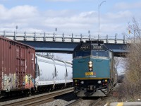 With CN 368 heading east at right, VIA 635 with VIA 6405 leading arrives at Dorval Station.