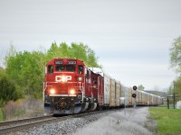 After meeting 240 at Lobo CP 235 is back on the roll again West rumbling across Melrose diamond. He would stop CN 148 and a quick sprint over to CN after his tail end passed allowed me to make it just in time.  