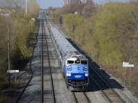 AMT 1346 pushes a deadhead move west on the triple-tracked and passenger-only Westmount Sub during the morning rush hour. The bilingual signs on either side indicate that Montreal West is a mile west of here.