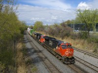 CN 3031, CN 3144 and CREX 1508 lead CN 120 around a curve on CN's Montreal Sub as it approaches Turcot Ouest.