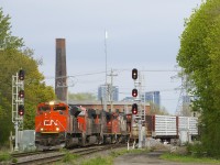 CN 401 with CN 8008, CN 2888, CN 4799 & CN 4802 heads west through the St-Henri neighbourhood of Montreal.