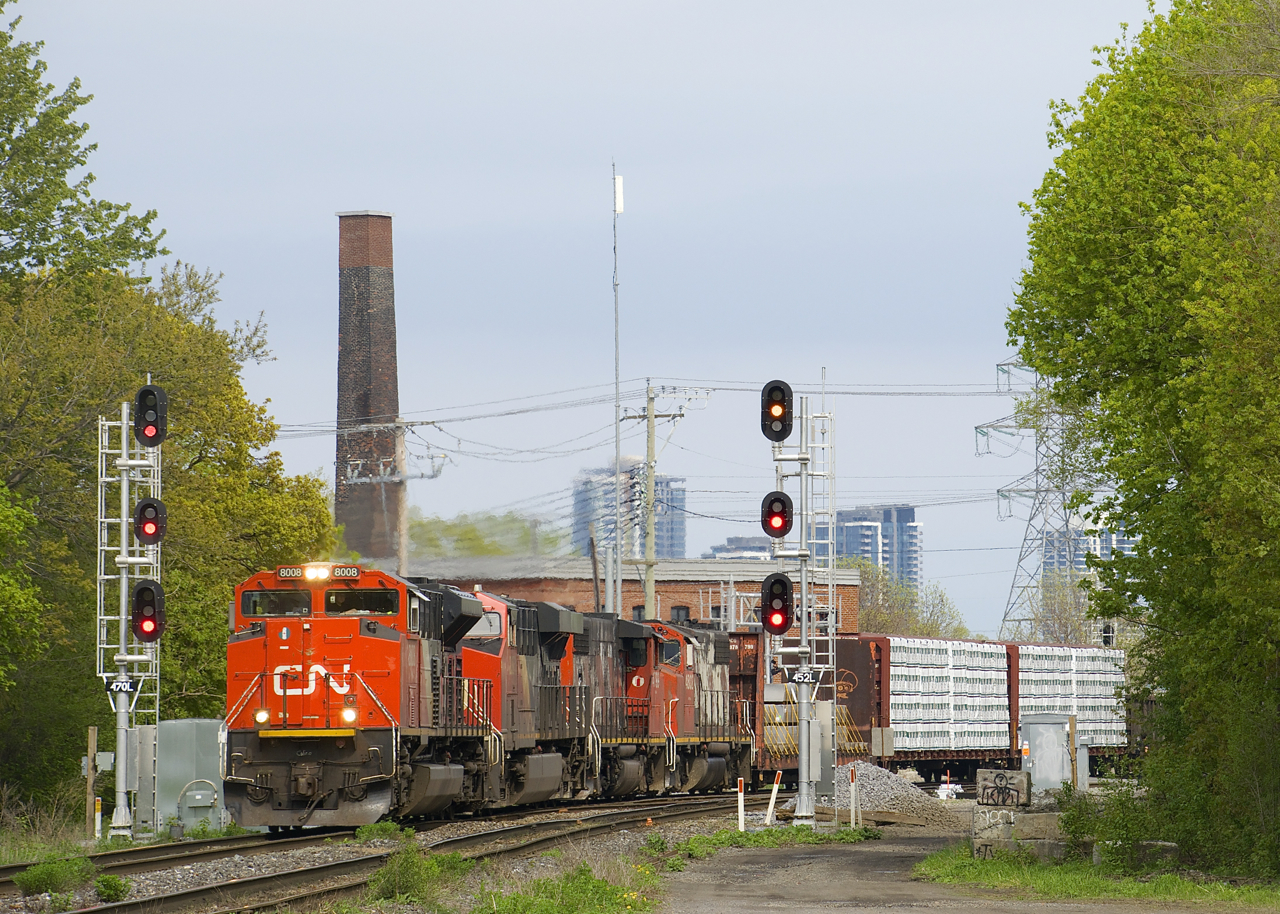 CN 401 with CN 8008, CN 2888, CN 4799 & CN 4802 heads west through the St-Henri neighbourhood of Montreal.