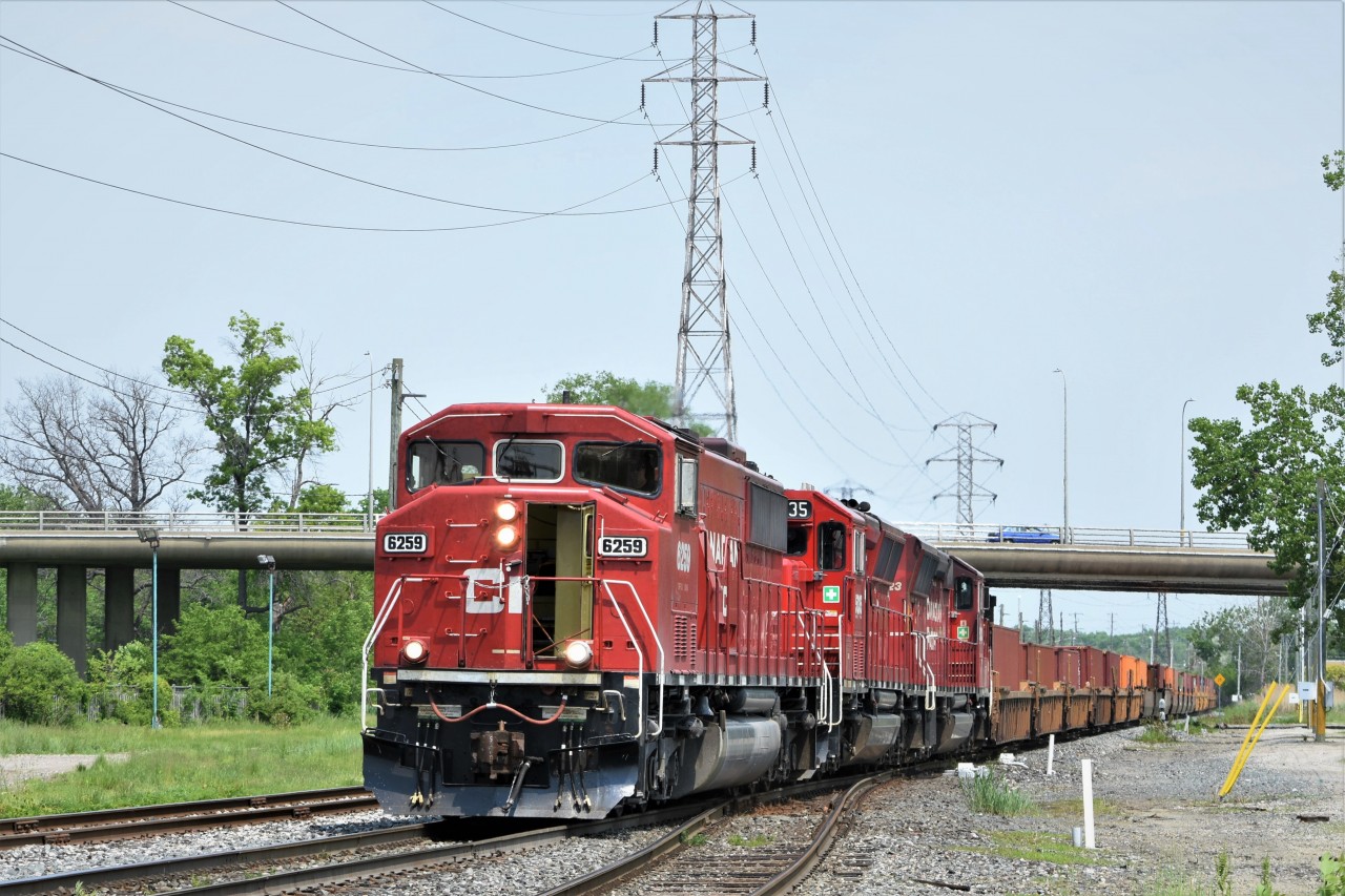 With a pretty humid May day, the crew of CP 235 has the door open to allow some natural air conditioning before heading through the tube and into the US.