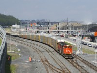 CN 401 has a pair of SD70M-2's (CN 8008 & CN 8836) as it ducks under a signal bridge at Turcot Ouest as the sun comes at just the right time. Behind the head end autoracks are TankTrain cars.