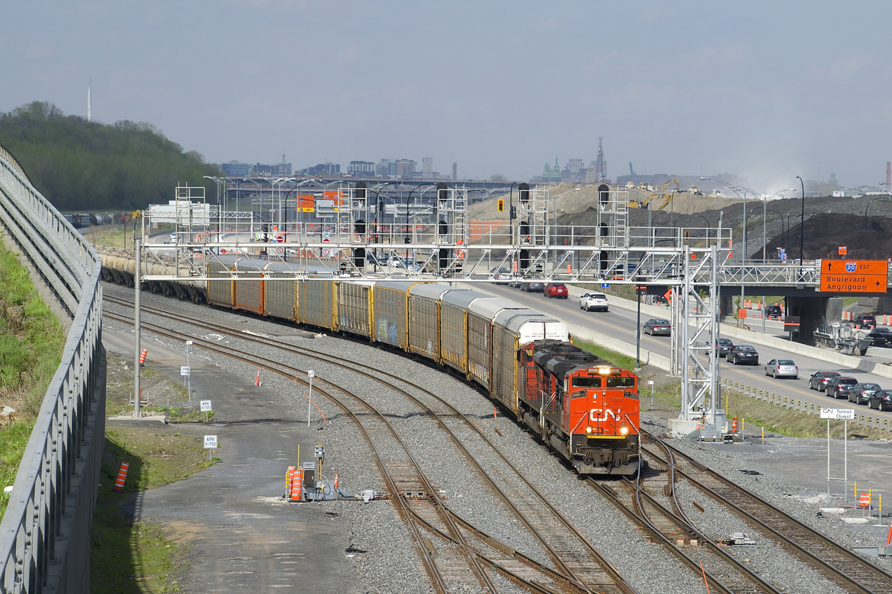 CN 401 has a pair of SD70M-2's (CN 8008 & CN 8836) as it ducks under a signal bridge at Turcot Ouest as the sun comes at just the right time. Behind the head end autoracks are TankTrain cars.