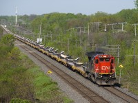 Standard cab CN 2125 is more than enough power for this train of empty flats, heading back to the QGRY for more windmill towers as it passes through Beaconsfield on a sunny morning.