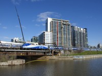The final train of the morning from Mont St-Hilaire has just overtaken the deadheading <i>Adirondack</i> at left as both make their way to Central Station.