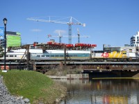After arriving from Ottawa, VIA 22 with VIA 6437 for power is shoving out of Central Station before wyeing on the Montreal Sub so that it can cross the Victoria Bridge on its way to its destination of Quebec City.