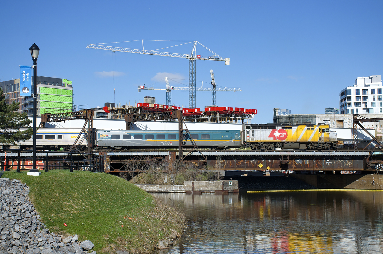 After arriving from Ottawa, VIA 22 with VIA 6437 for power is shoving out of Central Station before wyeing on the Montreal Sub so that it can cross the Victoria Bridge on its way to its destination of Quebec City.