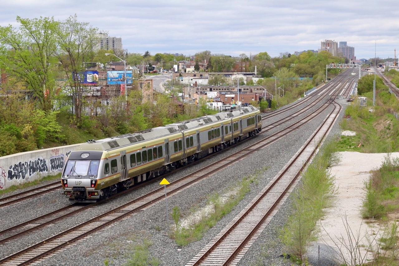 While I don’t really find the UPX trains all that exciting, I do like the shots in both directions off the Rogers Road bridge overlooking the Weston and Mactier subdivisions. I would imagine this is quite the busy spot on week day mornings, with the possibility of catching not just the UPX but also VIA, GO, CP and the rare chance of a CN. This vantage point looks northwest as a Person bound UPX train has just ducked under Rogers Rd. A Union station bound UPX train can also be seen beyond the signal bridge. The tracks in view here are owned by Metrolinx, and the track to the far right is used by CN’s local that interchanges with CP at West Toronto. CP’s Mactier subdivision can be seen to the far right in the background.