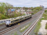 While I don’t really find the UPX trains all that exciting, I do like the shots in both directions off the Rogers Road bridge overlooking the Weston and Mactier subdivisions. I would imagine this is quite the busy spot on week day mornings, with the possibility of catching not just the UPX but also VIA, GO, CP and the rare chance of a CN. This vantage point looks northwest as a Person bound UPX train has just ducked under Rogers Rd. A Union station bound UPX train can also be seen beyond the signal bridge. The tracks in view here are owned by Metrolinx, and the track to the far right is used by CN’s local that interchanges with CP at West Toronto. CP’s Mactier subdivision can be seen to the far right in the background.