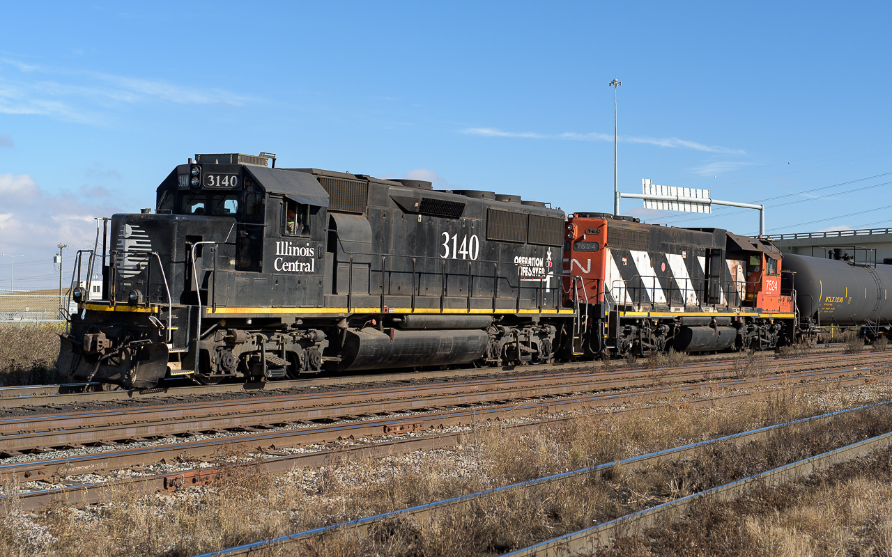 Clover Bar day crew shoving a cut of cars into customers located north of the mainline. IC 3140 only came to visit for a short while last fall. Within a few weeks of arriving it departed to wherever.