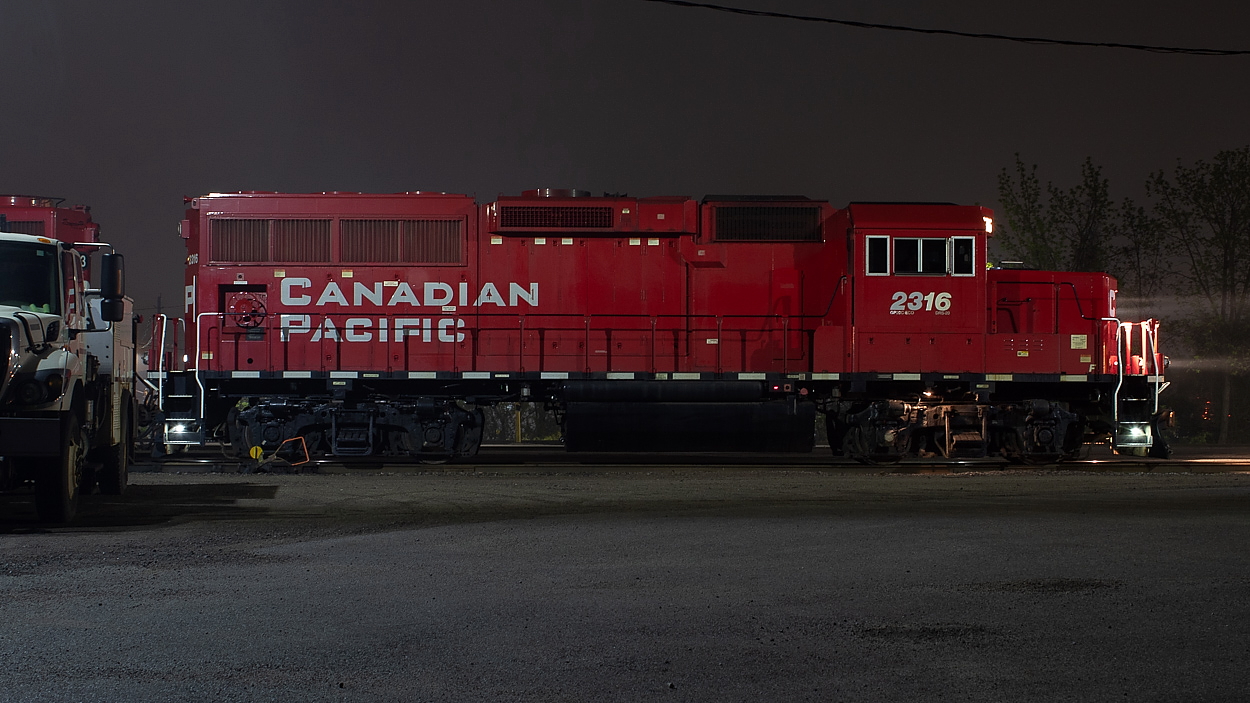 2316 is on point for TH41 as they work Aberdeen Yard, initially setting off plastic pellet hoppers, bulkheads, centrebeams, boxcars, and coils. This was shot a little less than an hour after they first arrived, and from what I observed I think they were nearing completion of the initial set offs at this point. I believe nights here can be quite long and tedious for the crews however, as they often have to cherry pick empty plastic pellet hoppers to take back to Kinnear. In between that, they have pushing duties to attend to, helping trains like 142 and 246 make the trip north up the escarpment. Aberdeen Yard is exclusively worked by the night crew, and is something I have seen a few times just driving by on my way home if I happen to get back to town late. This was my first attempt at shooting this job however, and luckily for me, the lead unit stopped in just the right spot for a shot.