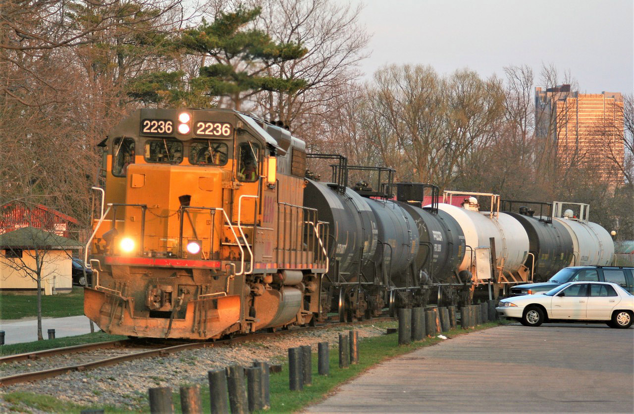 Goderich-Exeter Railway (GEXR) train 584 with LLPX 2236 is exiting Waterloo Park and approaching Seagram Drive in Waterloo in the fading light of a spring evening. This area has changed dramatically with the installation of the ION light rail network, which is set to officially begin operations on June 21, 2019.