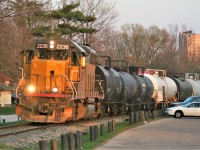 Goderich-Exeter Railway (GEXR) train 584 with LLPX 2236 is exiting Waterloo Park and approaching Seagram Drive in Waterloo in the fading light of a spring evening. This area has changed dramatically with the installation of the ION light rail network, which is set to officially begin operations on June 21, 2019. 